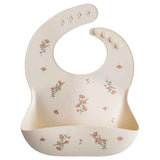 Mushie® Bavaglino in silicone Pink Flowers