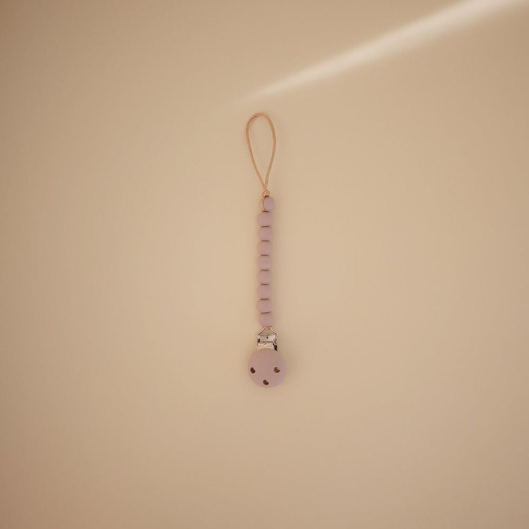 Mushie® Držalo za dudo Hera Soft Lilac Mushie