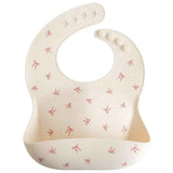 Mushie® Bavaglino in silicone Bows