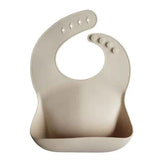 Mushie®  Bavaglino in silicone Shifting Sand
