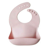 Mushie® Bavoir en silicone Blush