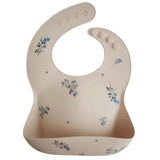 Mushie® Bavoir en silicone Lilac Flowers