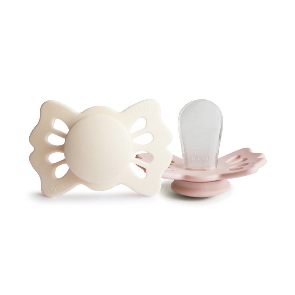 Frigg® Simetrična Duda iz silikona Lucky Cream/Blush 0-6 M FRIGG