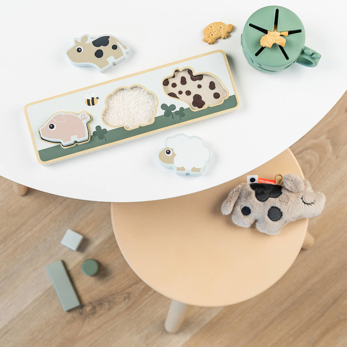 Done by Deer® Senzorična sestavljanka Tiny Farm Done by Deer