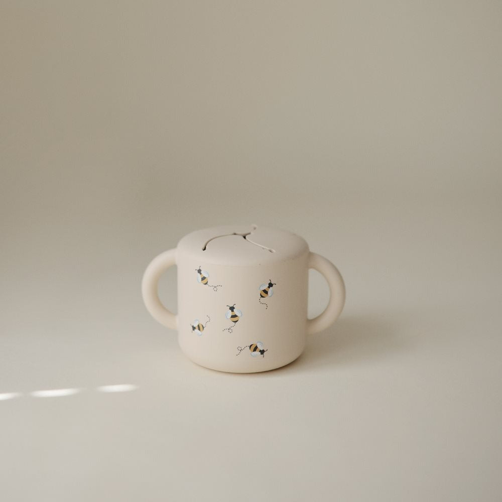 Mushie® Silikonska posodica za prigrizke Bees Mushie